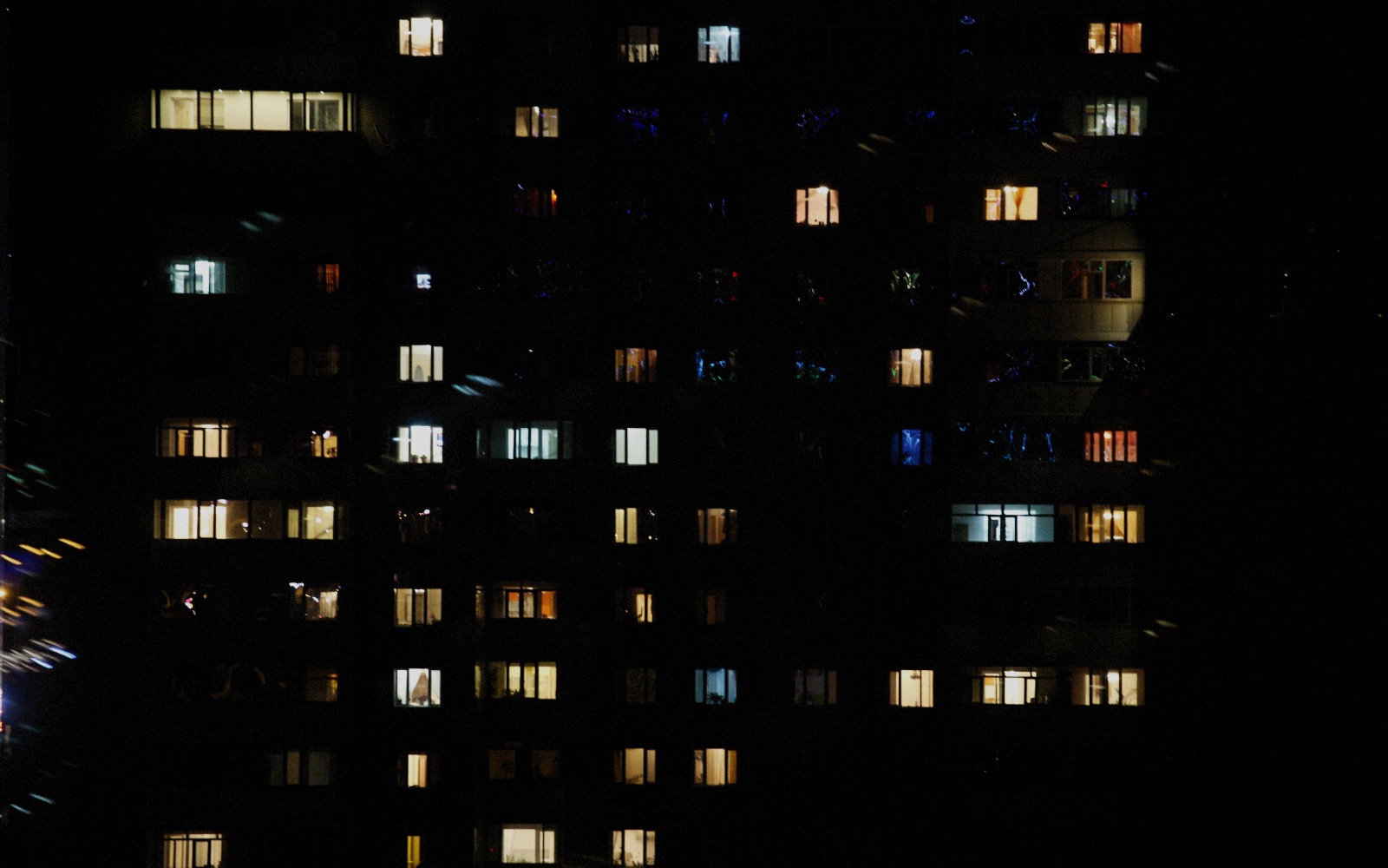 Lit apartment windows at night